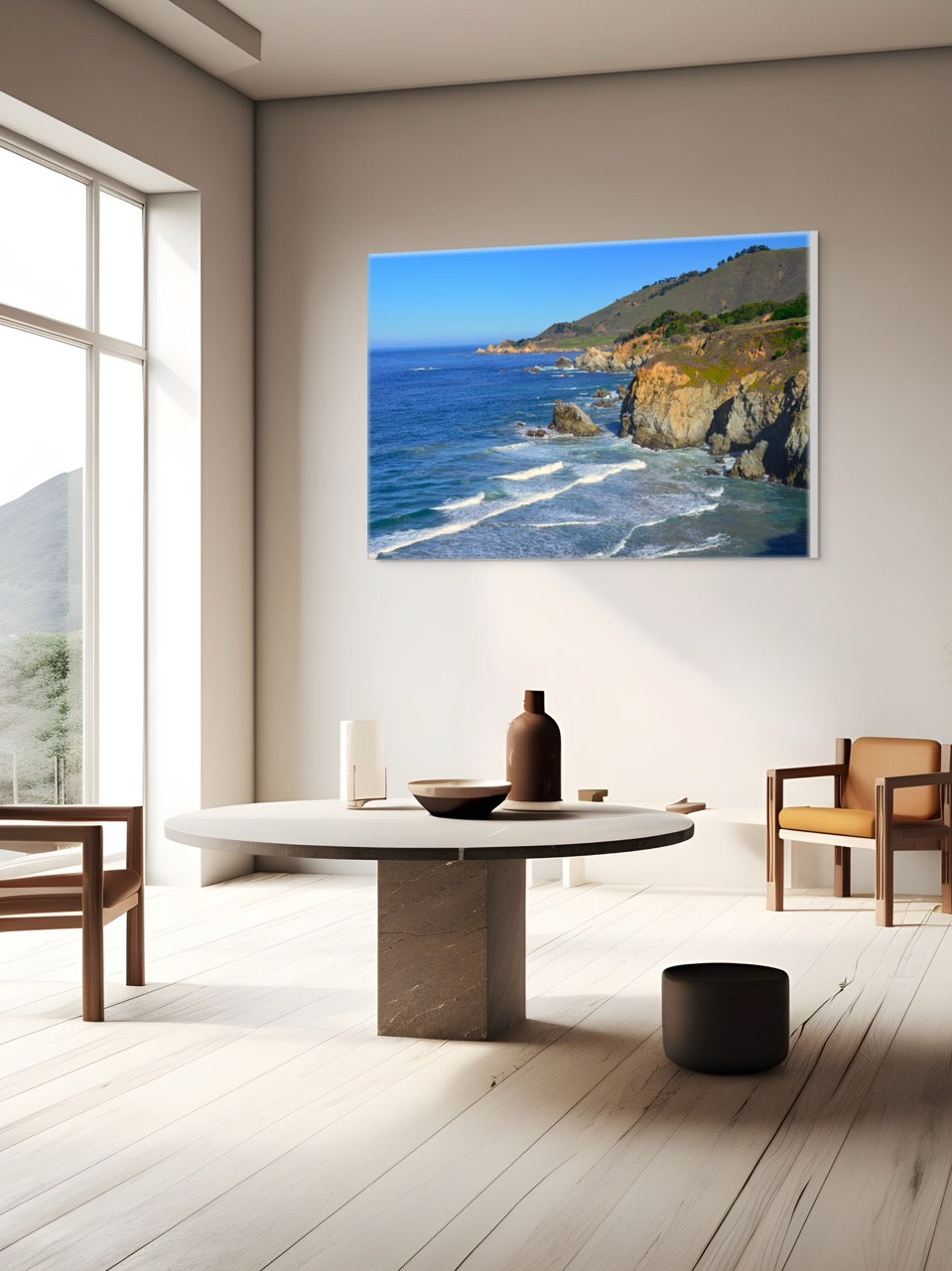 Modern living room with a large canvas print of the rugged coastline in Big Sur, California on the wall.
