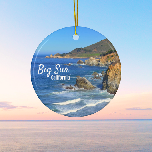 Ceramic Christmas ornament featuring a photograph of the rugged cliffs and deep blue Pacific Ocean along the Big Sur coastline in California, featuring a beach and ocean.