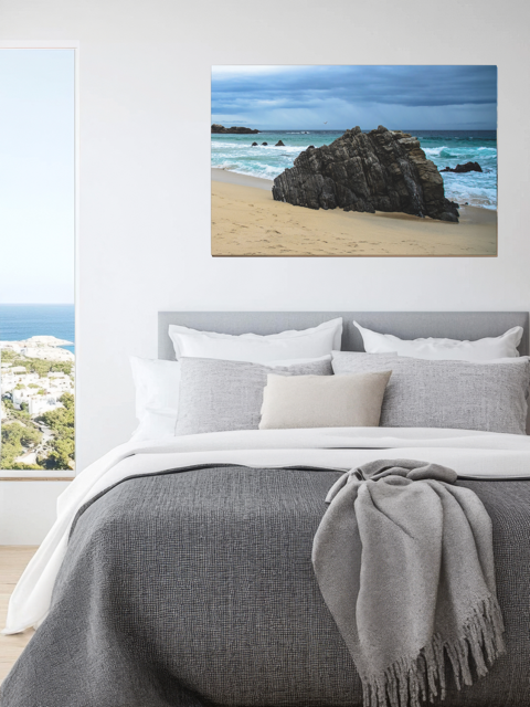 Big Sur California coastal rock formation canvas print on a wall above a bed