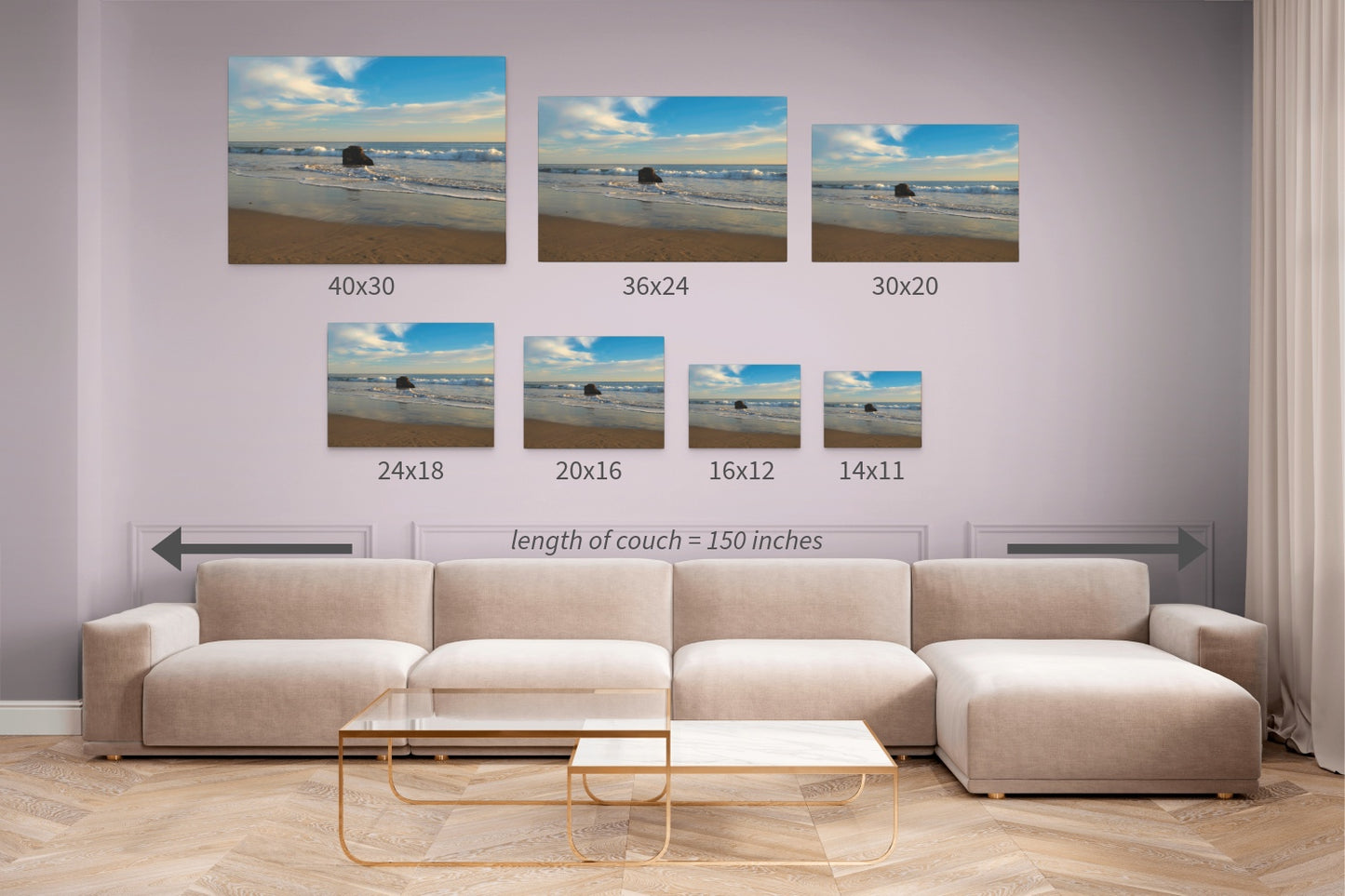 Beige sectional sofa with wall art displaying different measurements of a solitary rock on a California beach with ocean wave foam and sky reflection canvas print.
