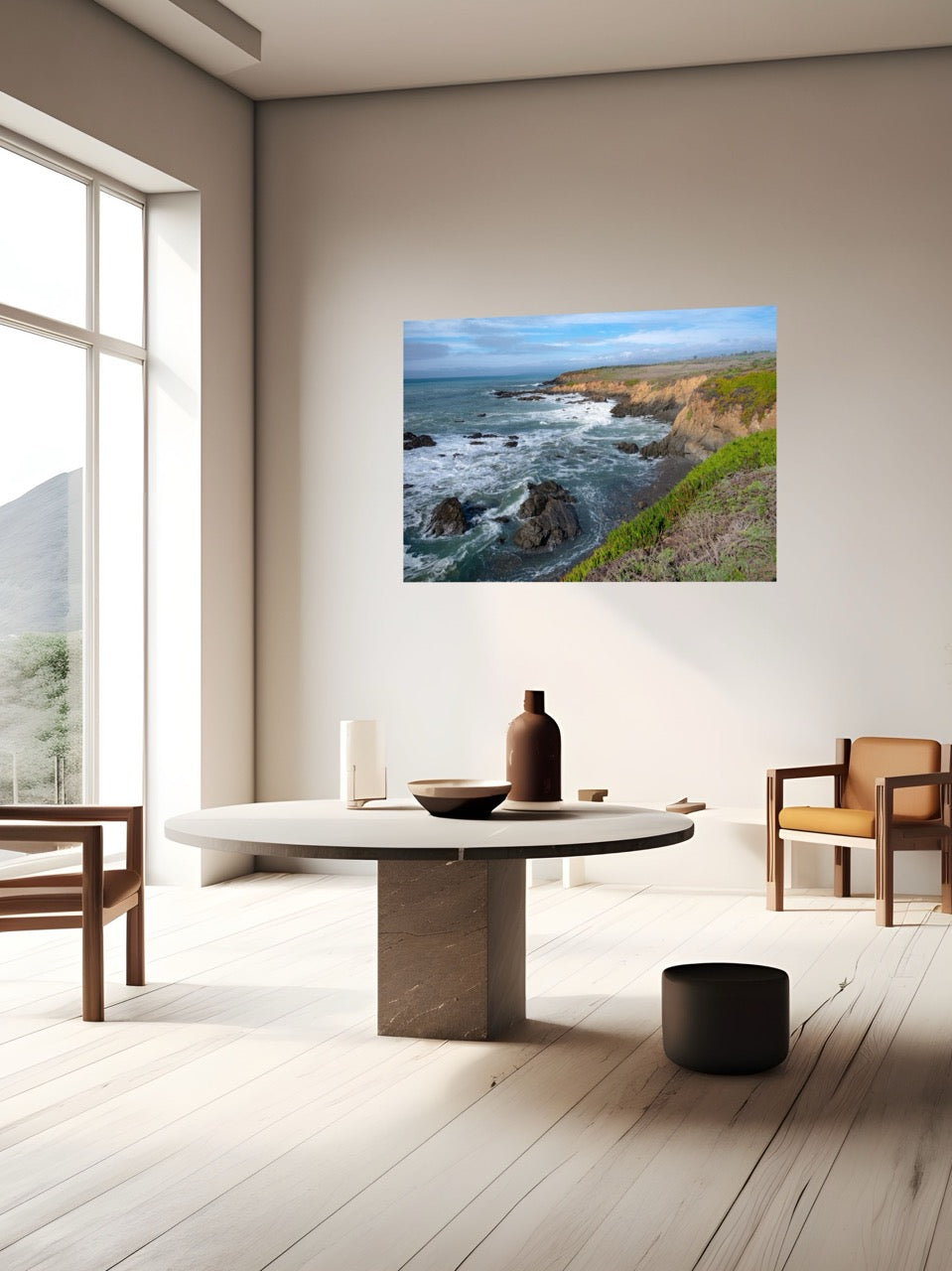 Modern living room with a scenic wall art of a coastal landscape.