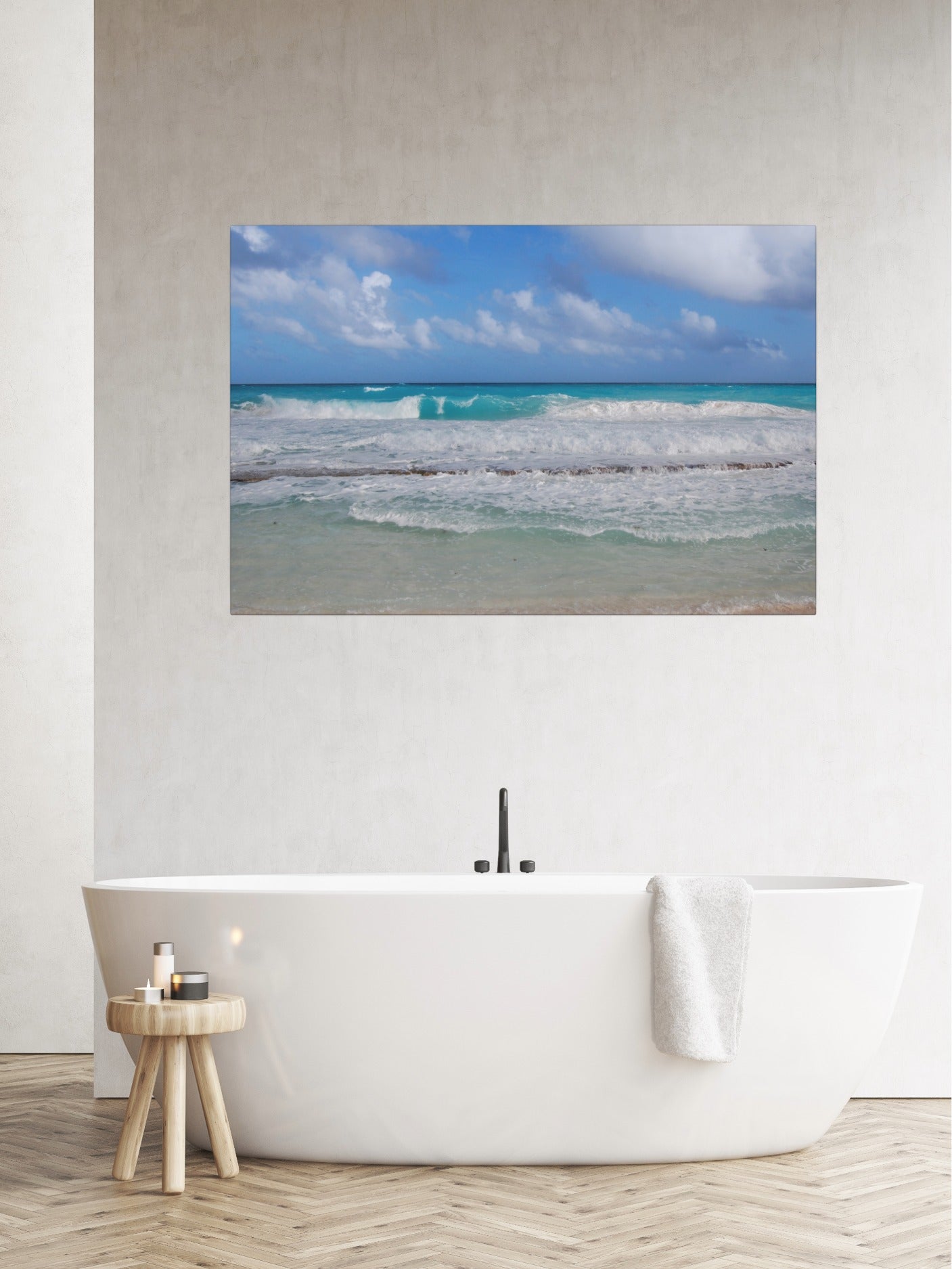 Cancun Caribbean turquoise waves breaking on sand canvas print above a freestanding bathtub in a bathroom.