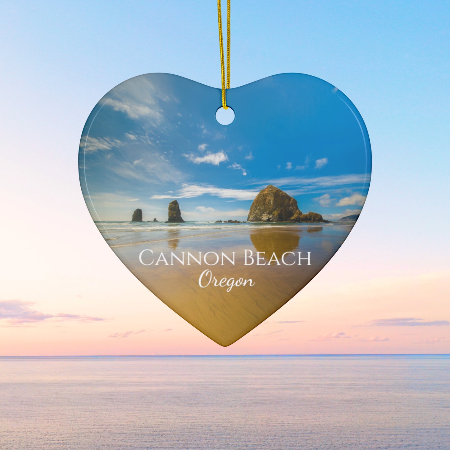 Heart-shaped ornament with Cannon Beach, Oregon scene