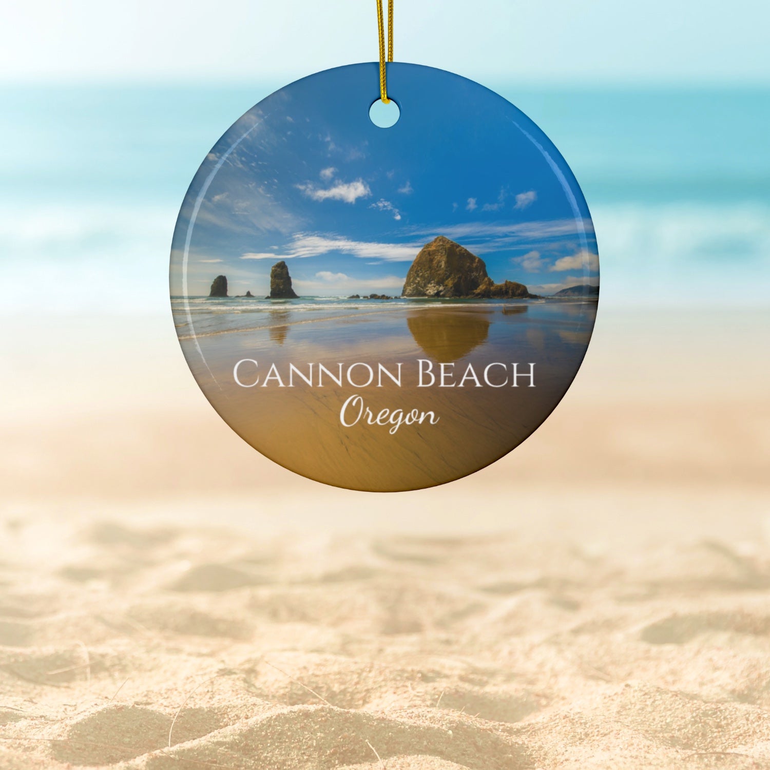 Round ornament with Cannon Beach, Oregon scene and text