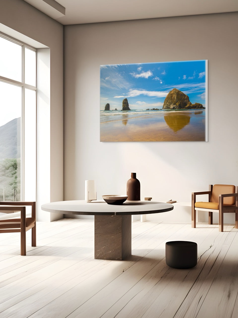 Modern living room with a large canvas print featuring a view of Haystack Rock and other rock off the coast of Cannon Beach, Oregon.