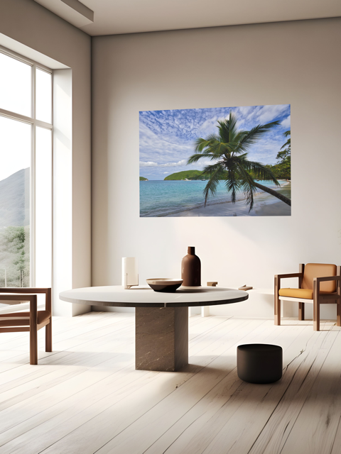 Modern interior with a round table and chairs, featuring a large canvas print of a tropical beach scene.