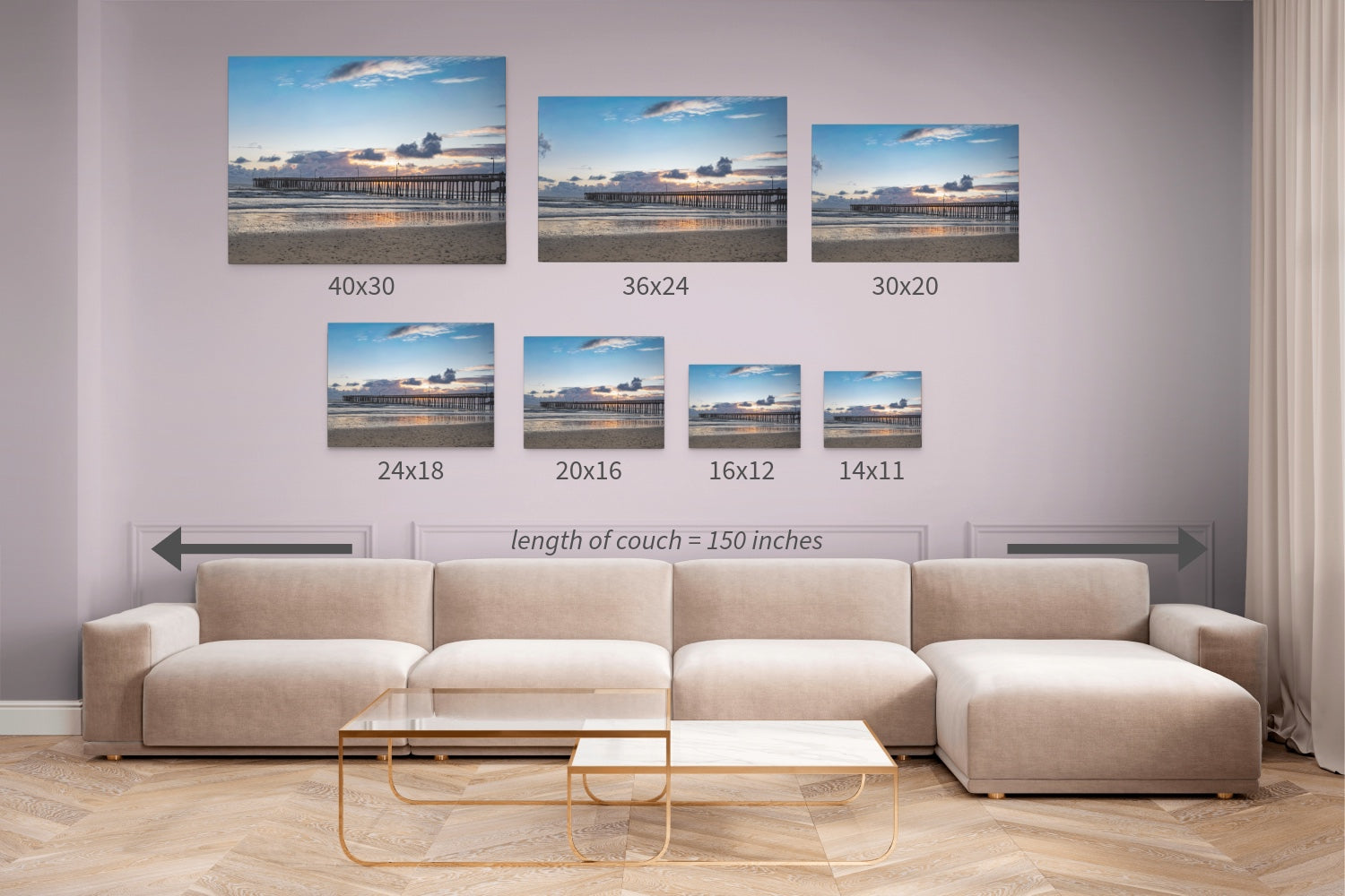Beige sectional sofa with a coffee table against a wall displaying different sizes of  Cayucos Pier sunset canvas print.