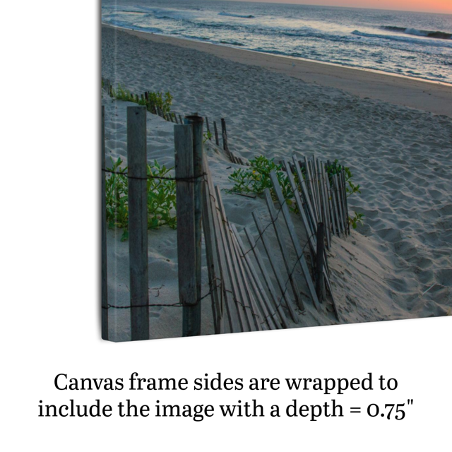 Side view of a canvas print of a coastal sunrise on a sandy beach with a weathered wooden fence demonstrating frame depth.