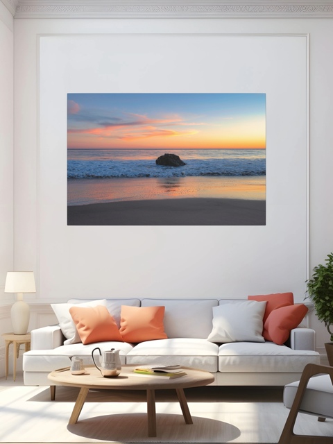 Living room with a large framed picture of a beach sunset on the wall.