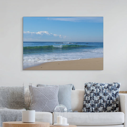 Crystal Cove State Beach breaking wave with translucent green water canvas print above a sofa with decorative pillows