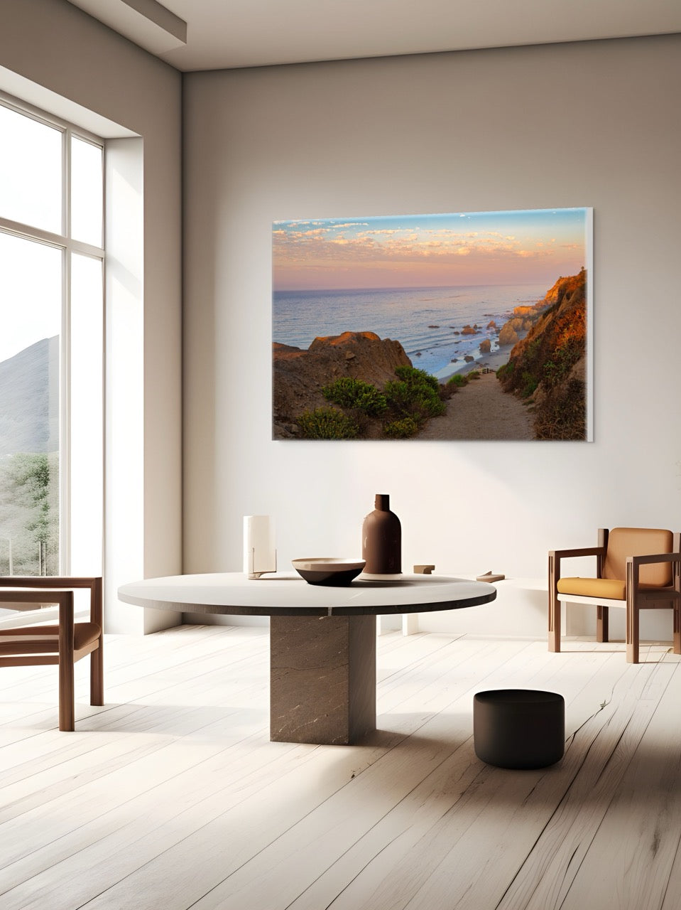 Modern living room with a large wall-mounted painting of a coastal scene.