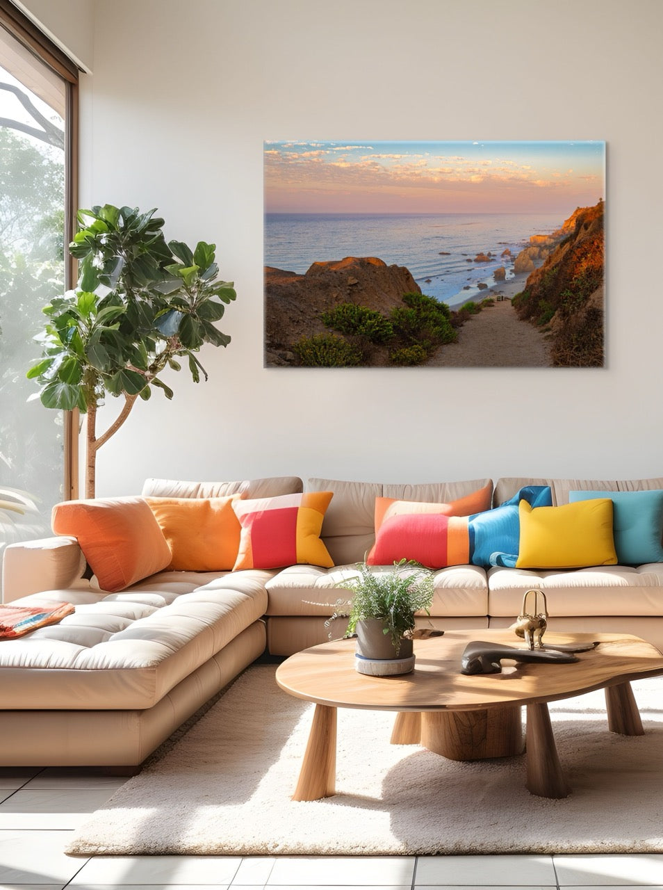 Modern living room with a sectional sofa, colorful pillows, and a canvas print of a coastal landscape on the wall.
