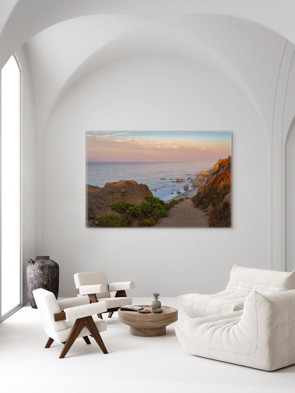 Modern living room with a large wall art depicting a coastal scene.