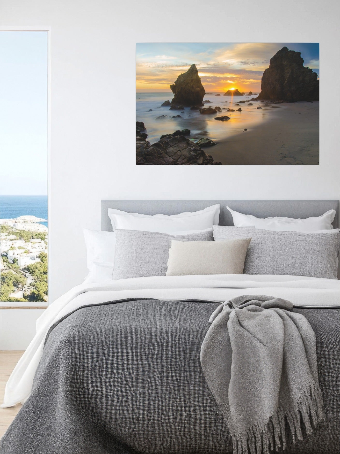 Bedroom with an El Matador State Beach winter sunset with dramatic sea stacks and golden sunburst canvas print above the bed.