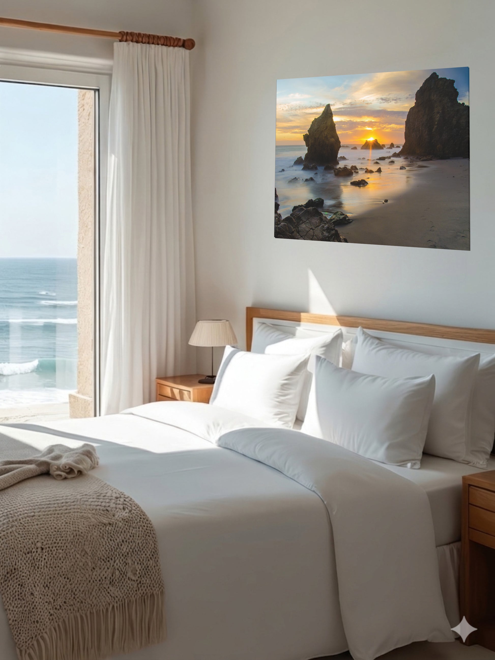 Bedroom with a large bed and an El Matador State Beach winter sunset with dramatic sea stacks and golden sunburst canvas print on the wall.
