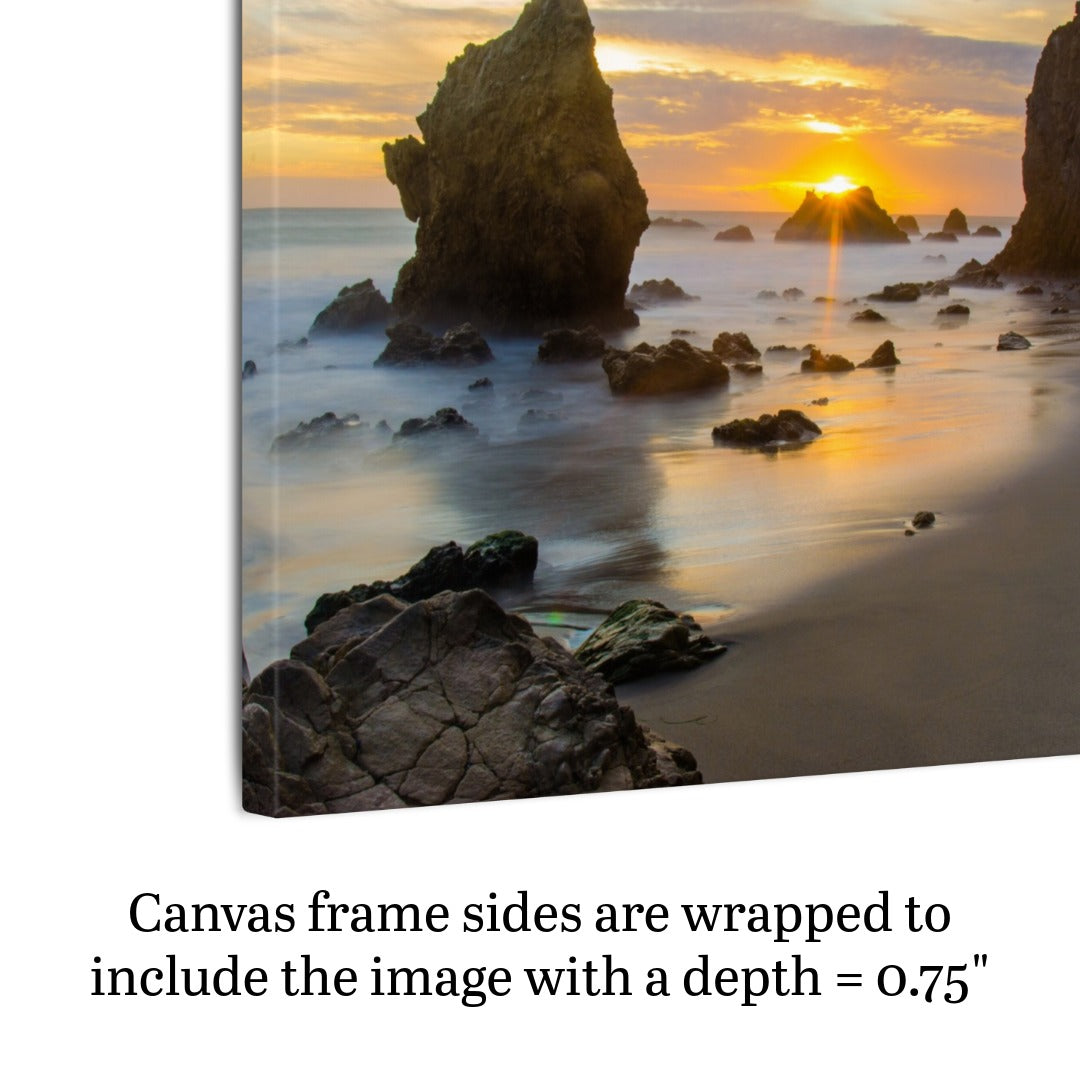Side view of an El Matador State Beach winter sunset with dramatic sea stacks and golden sunburst canvas print with text indicating frame depth.