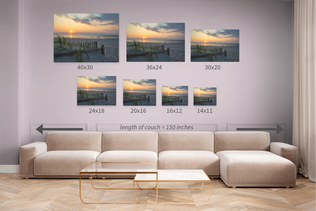 Wall art prints featuring a sunrise over the ocean as seen from behind the dunes on the Jersey Shore with corresponding dimensions displayed above a beige sofa.