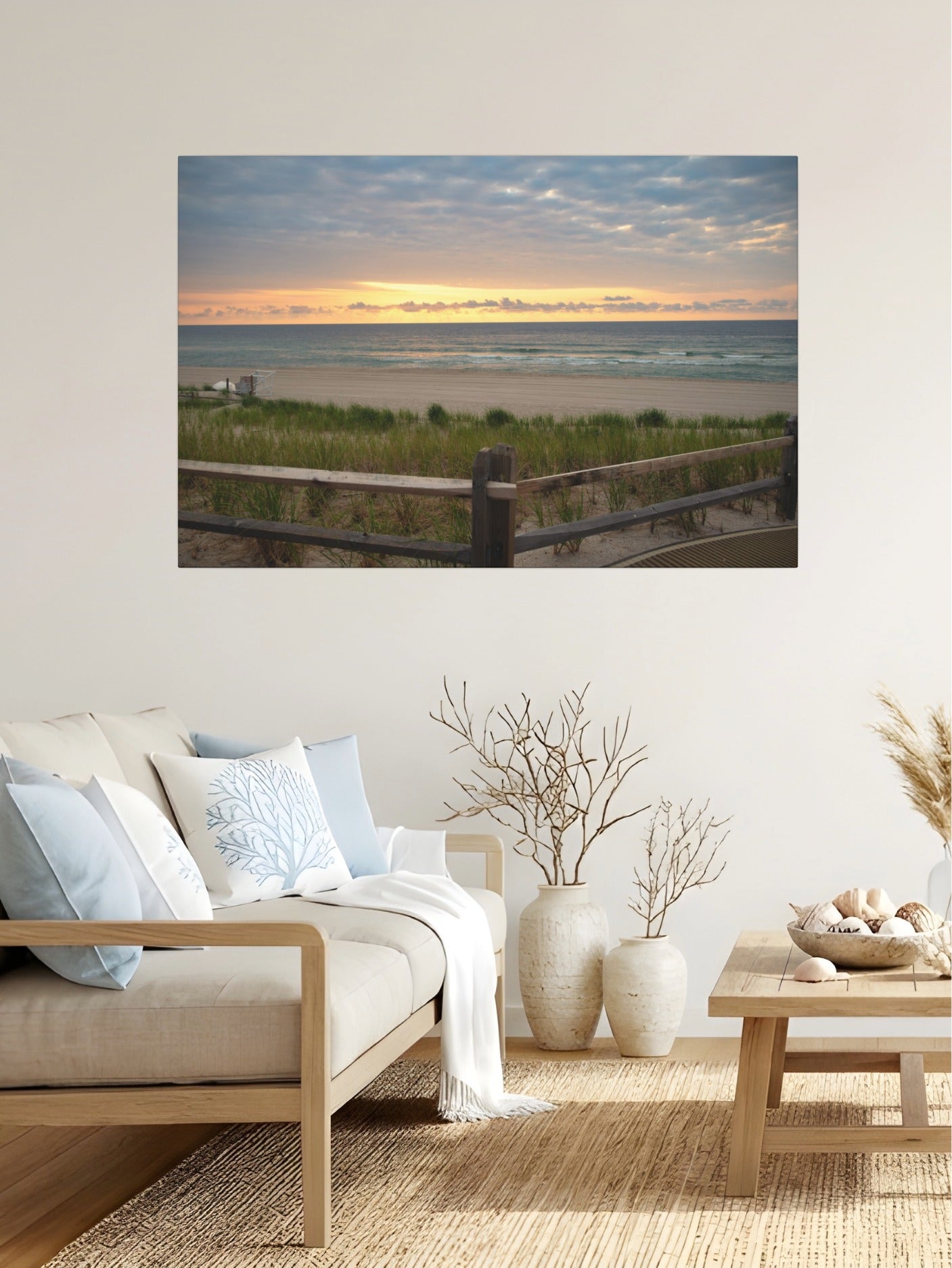 Living room with a canvas print of a Jersey Shore sunrise over the Atlantic Ocean with beach dunes and grass on the wall