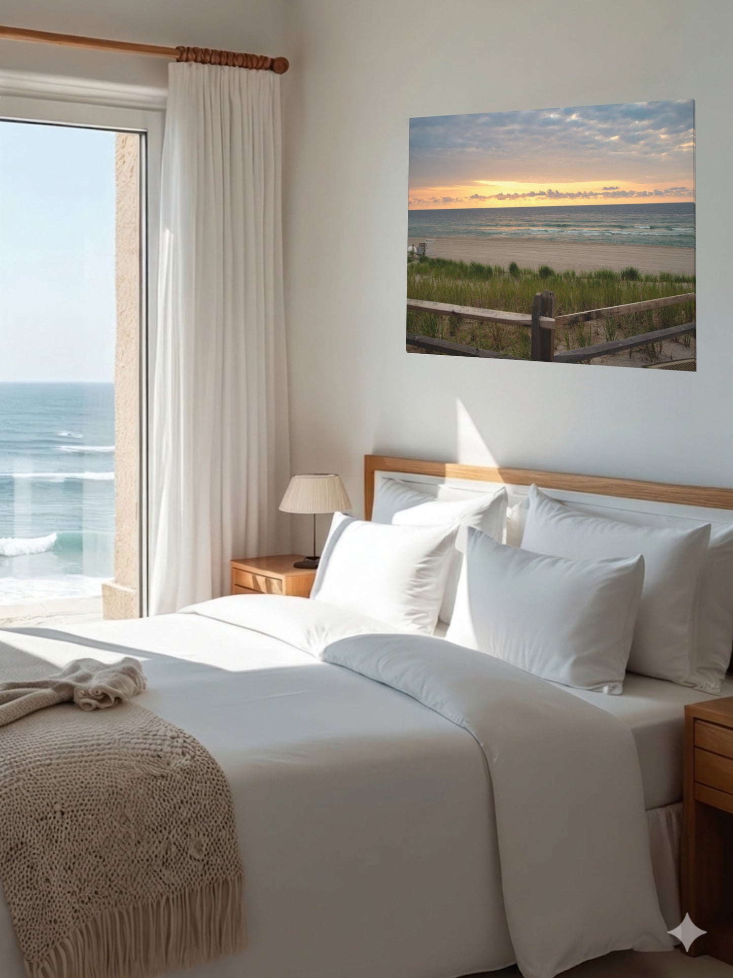 Bedroom with a large bed, nightstands, and a canvas print of a Jersey Shore sunrise over the Atlantic Ocean with beach dunes and grass.