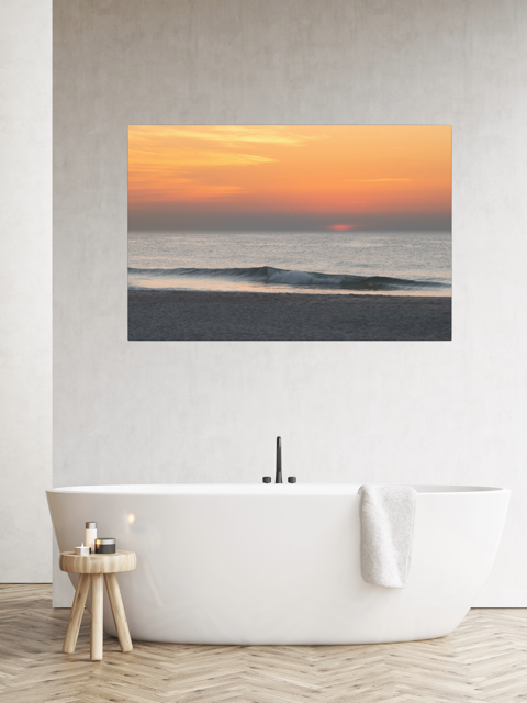 Modern bathroom with a canvas print of a hazy sunrise over the ocean down the Jersey Shore.