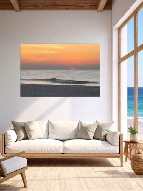 Living room with a lcanvas print of a hazy sunrise over the ocean down the Jersey Shore, a white sofa, and a window view.