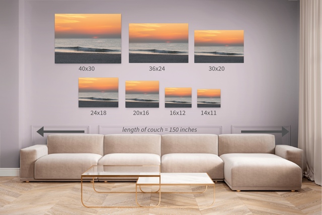 Canvas prints of a hazy sunrise over the ocean down the Jersey Shore displayed above a sofa with measurements.