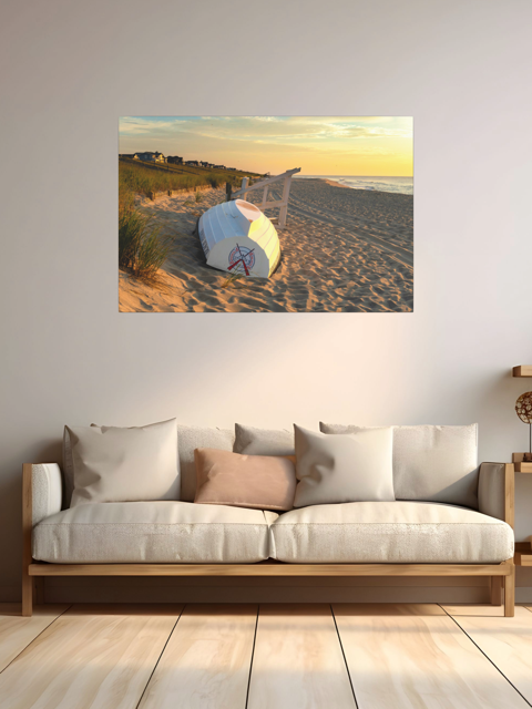 Canvas print of an overturned Jersey Shore Beach Patrol boat and lifeguard stand on the sand at sunrise with beach grass and rolling dunes on a wall above a sofa