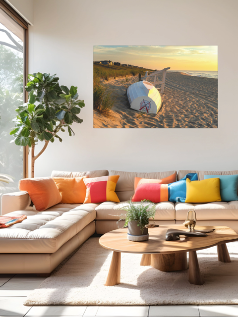 Modern living room with a sectional sofa, colorful pillows, and a canvas print of an overturned Jersey Shore Beach Patrol boat and lifeguard stand on the sand at sunrise with beach grass and rolling dunes on the wall.