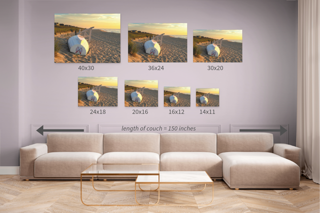 Living room with a beige sectional sofa and wall art displaying various sizes of a landscape print.