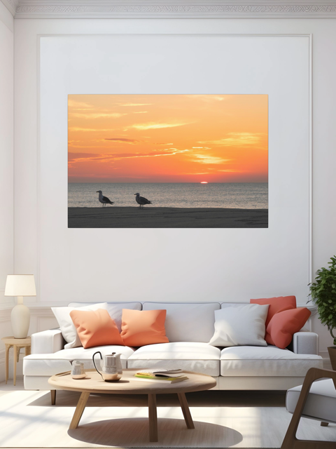 Living room with a canvas print of two seagulls standing on a sandy Jersey Shore beach during a vibrant orange sunrise over the Atlantic Ocean