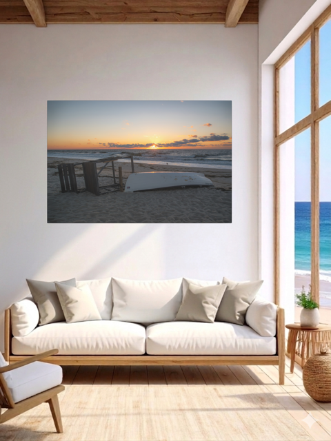 Living room with a canvas print of a Jersey Shore sunrise on the wall, wooden floor, and white sofa.