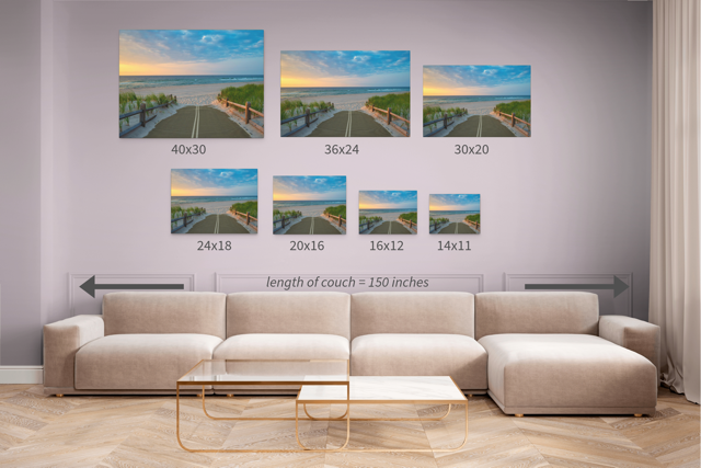 Wall art prints featuring a beach path on the Jersey Shore shortly after sunrise over the ocean with corresponding dimensions displayed above a beige sofa.