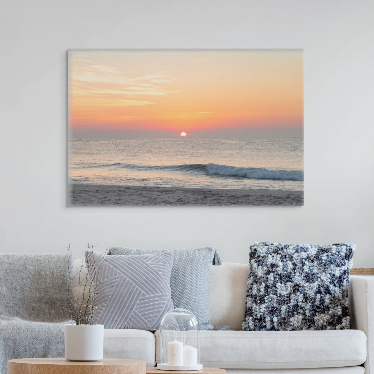 Living room with a large canvas print featuring a summer sunrise over the Atlantic Ocean as seen from a quiet beach on the Jersey Shore on the wall.