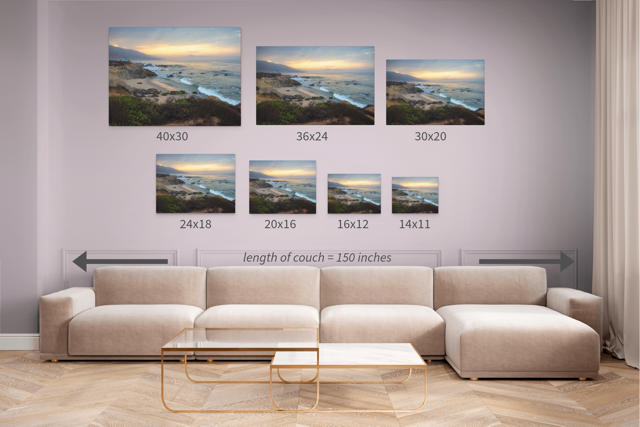 Wall art prints featuring a view of the sunrise over the mountains as seen from the cliffs of Leo Carrillo State Beach with corresponding dimensions displayed above a beige sofa.