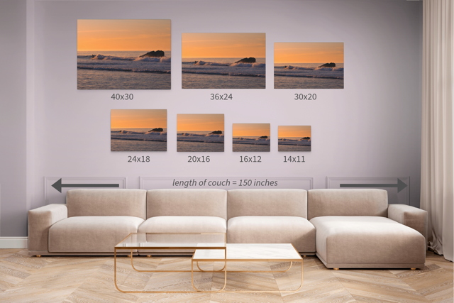 Living room with a beige sectional sofa and canvas prints in different sizes featuring a surfer riding a wave at sunrise.