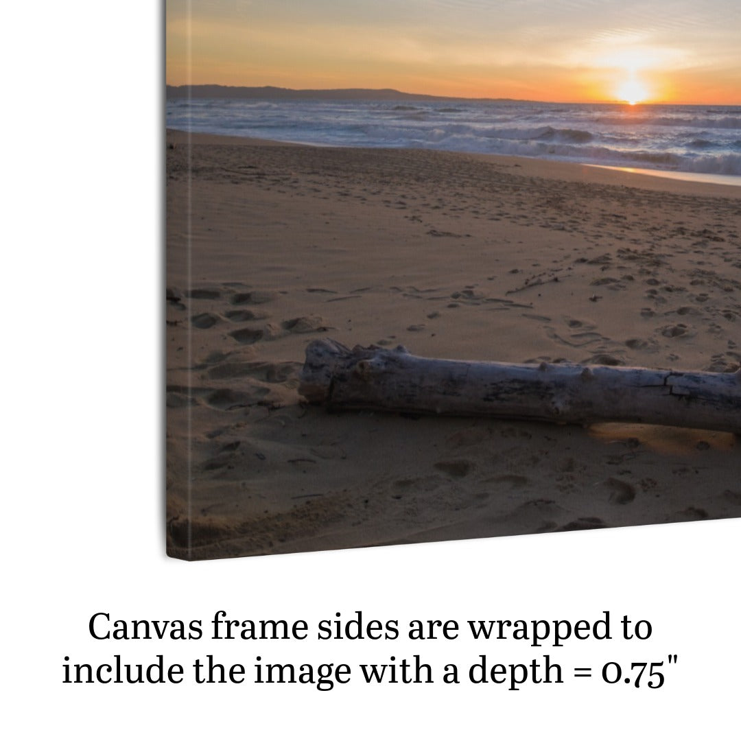 Canvas print of a Monterey California beach sunset with large driftwood log on sand, text indicating canvas frame depth.
