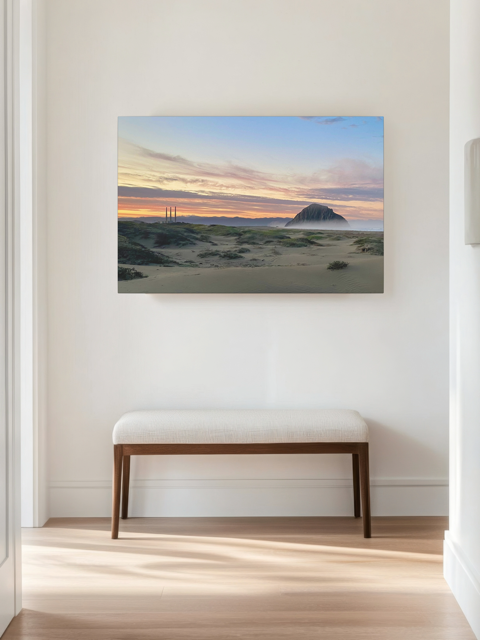 Vibrant sunrise over Morro Rock and Three Stacks from beach dunes canvas print on wall above bench