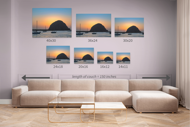 Living room with a beige sectional sofa and wall art displaying various sizes of a Morro Rock sunset.