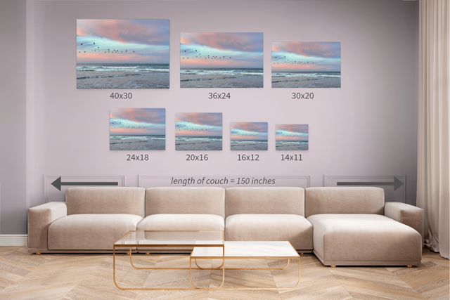 Wall art set with dimensions displayed above a sofa