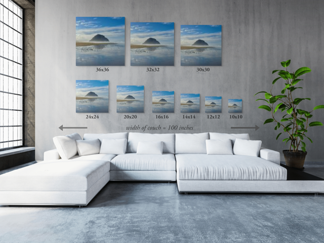 Wall art prints featuring Morro Rock  with corresponding dimensions displayed above a sectional sofa.