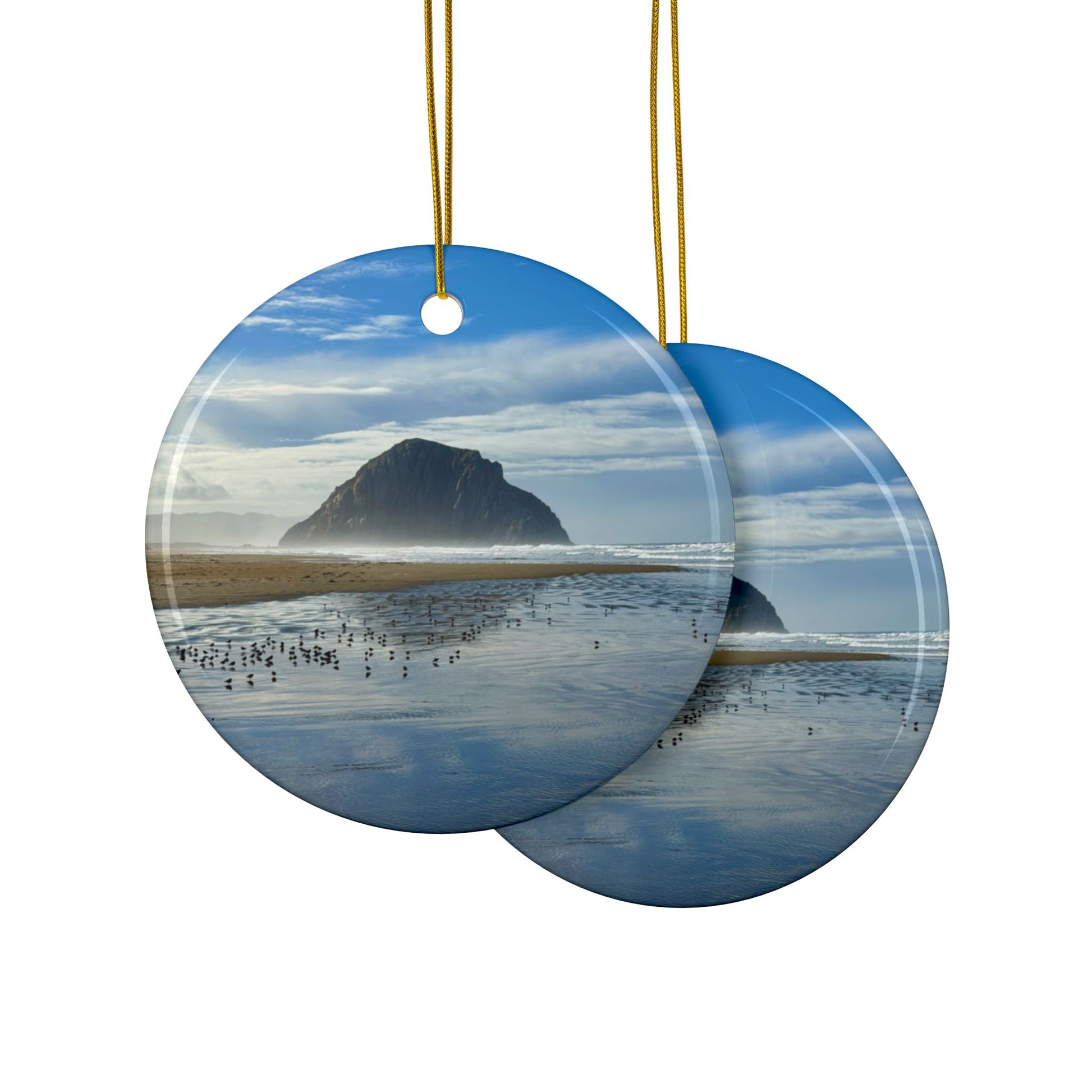 Front and back side of a ceramic holiday ornament featuring a professional photograph of Morro Rock in Morro Bay, California, with the Pacific surf in the foreground.