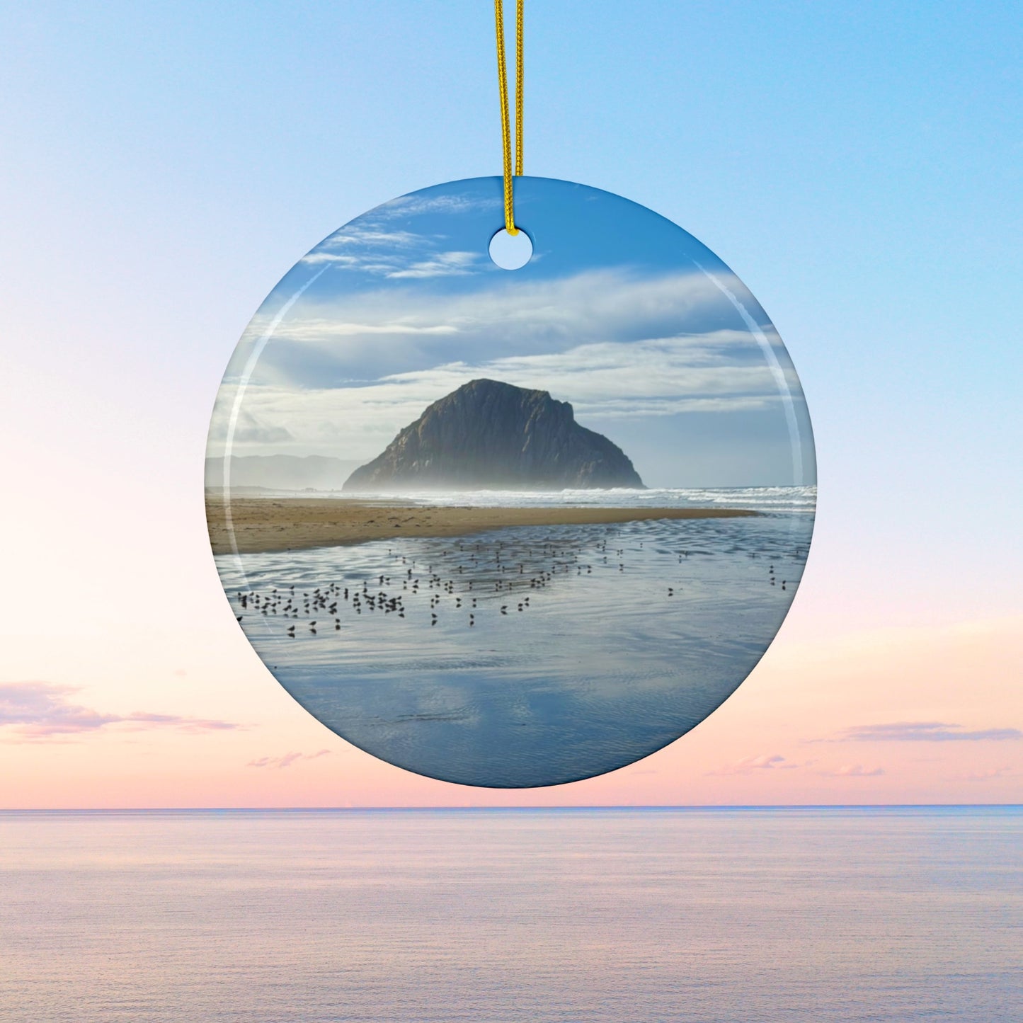 Ceramic holiday ornament featuring a professional photograph of Morro Rock in Morro Bay, California, with the Pacific surf in the foreground.