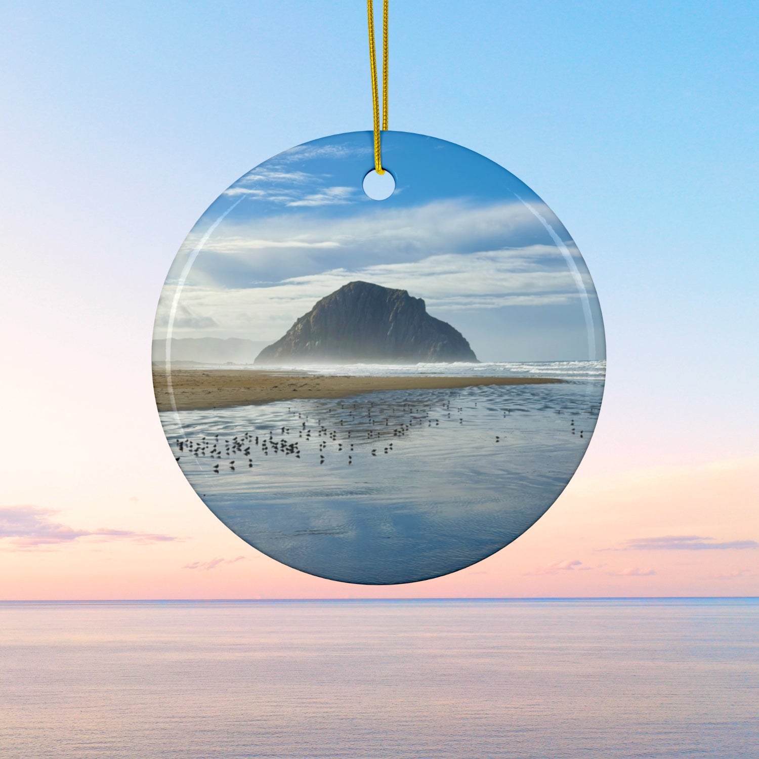 Ceramic holiday ornament featuring a professional photograph of Morro Rock in Morro Bay, California, with the Pacific surf in the foreground.