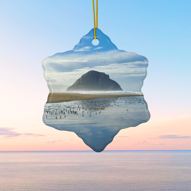 Ceramic holiday ornament featuring a professional photograph of Morro Rock in Morro Bay, California, with the Pacific surf in the foreground.