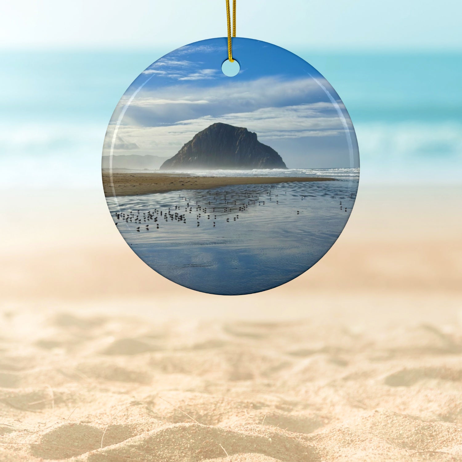 Ceramic holiday ornament featuring a professional photograph of Morro Rock in Morro Bay, California, with the Pacific surf in the foreground.