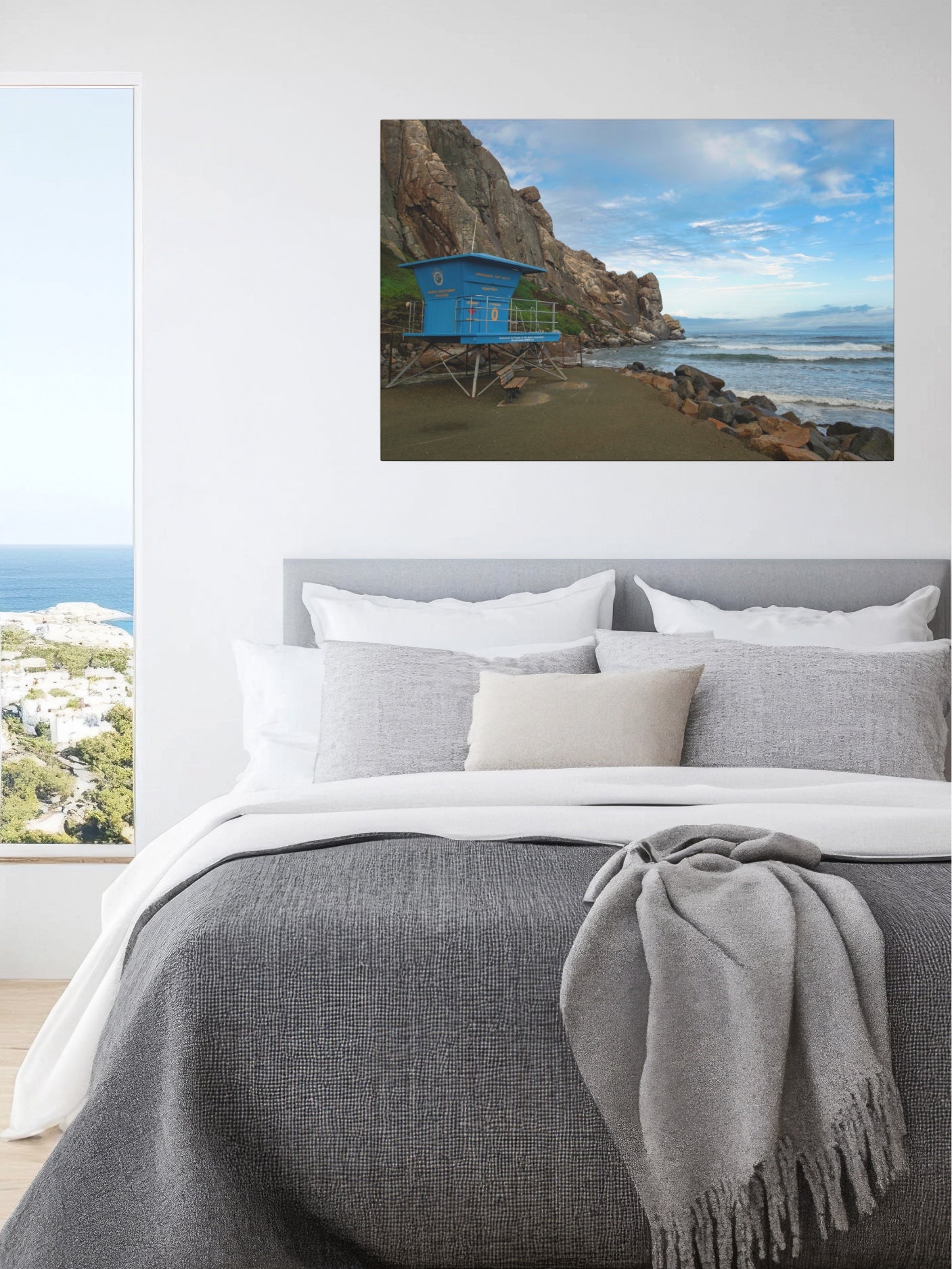 Bedroom with a blue lifeguard tower at the base of Morro Rock in Morro Bay California canvas print of a coastal scene with a blue hut.