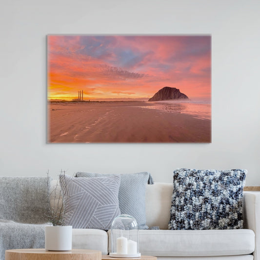 Living room with a large canvas print of Morro Rock and the stacks at sunrise on the wall