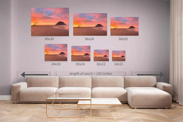 Living room with a beige sectional sofa and wall art displaying canvas prints of Morro Rock and the stacks at sunrise in various sizes.