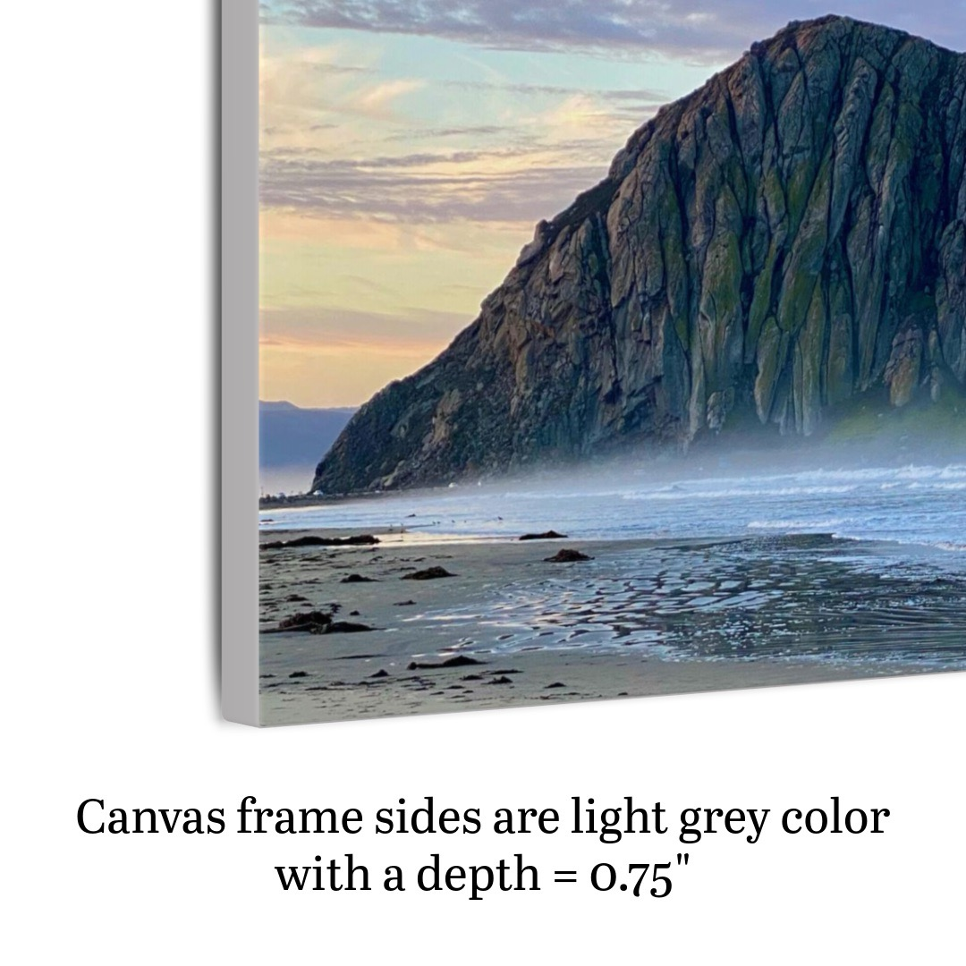 Canvas print of a sunrise at Morro Rock in Morro Bay, California with a surfer on the beach shown on an angle to highlight side framing and depth.