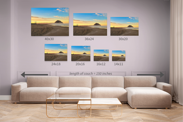 Wall art prints featuring Morro Rock and the stacks at sunrise with corresponding dimensions displayed above a beige sofa.